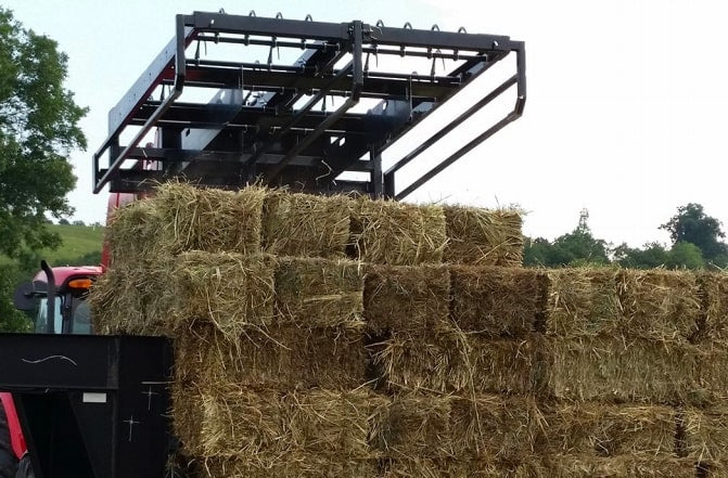 bales piled up using the bale accumulator attachment from top dog