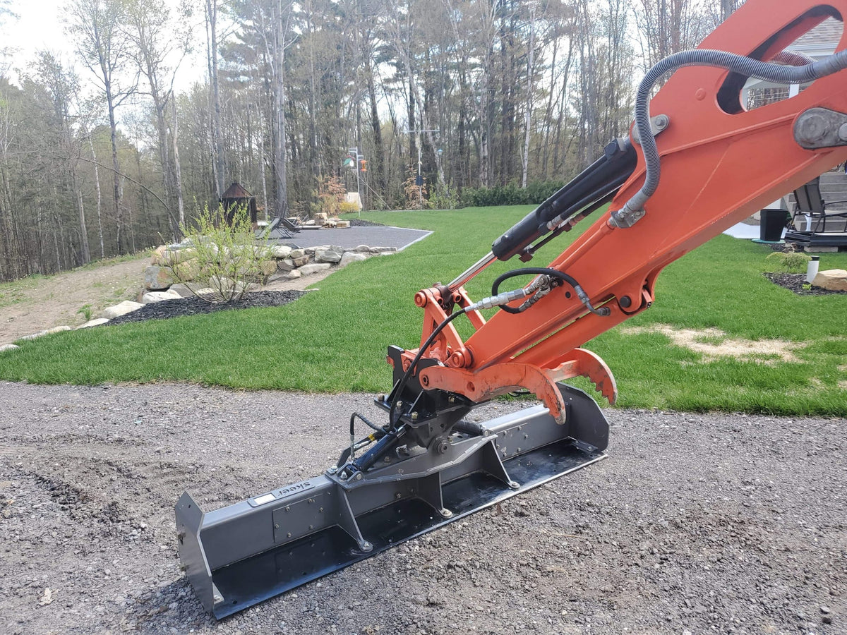 excavator with the grading beam attachment from skeer system