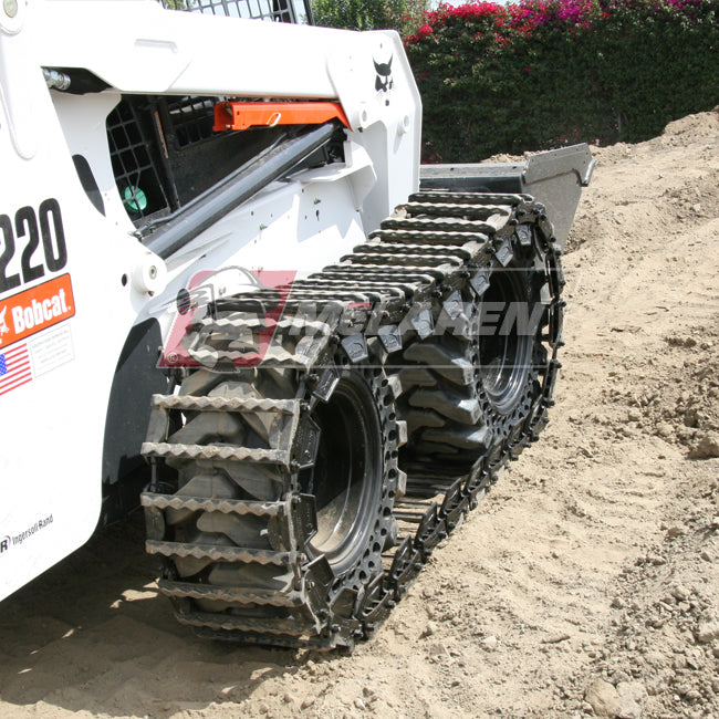bobcat skid steer with the diamond over the tire tracks by mclaren industries