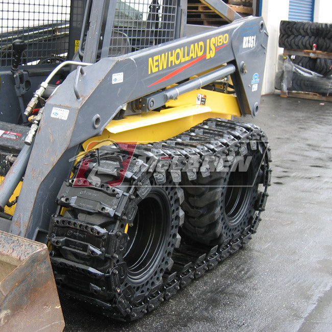 new holland skid steer with the magnum over the tire tracks by mclaren