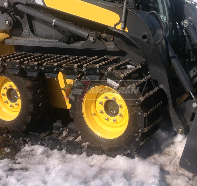 skid steer with the maximizer over the tire tracks by mclaren