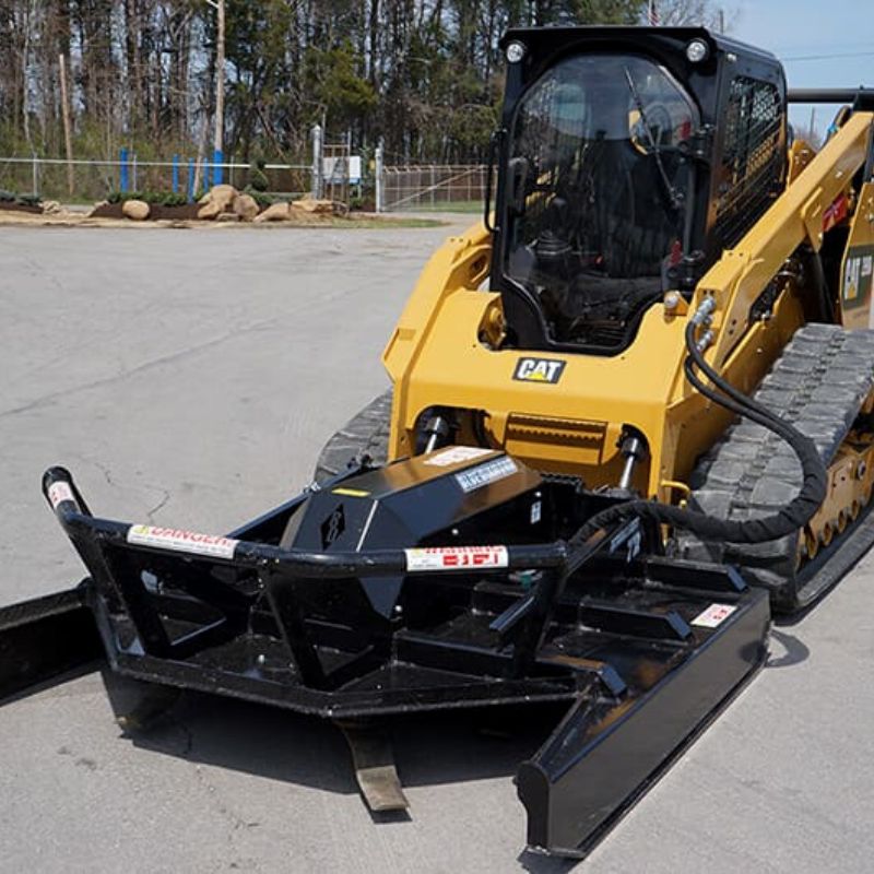 CAT mini skid steer with the Brush Cutter Extreme Duty Open Front by Blue Diamond