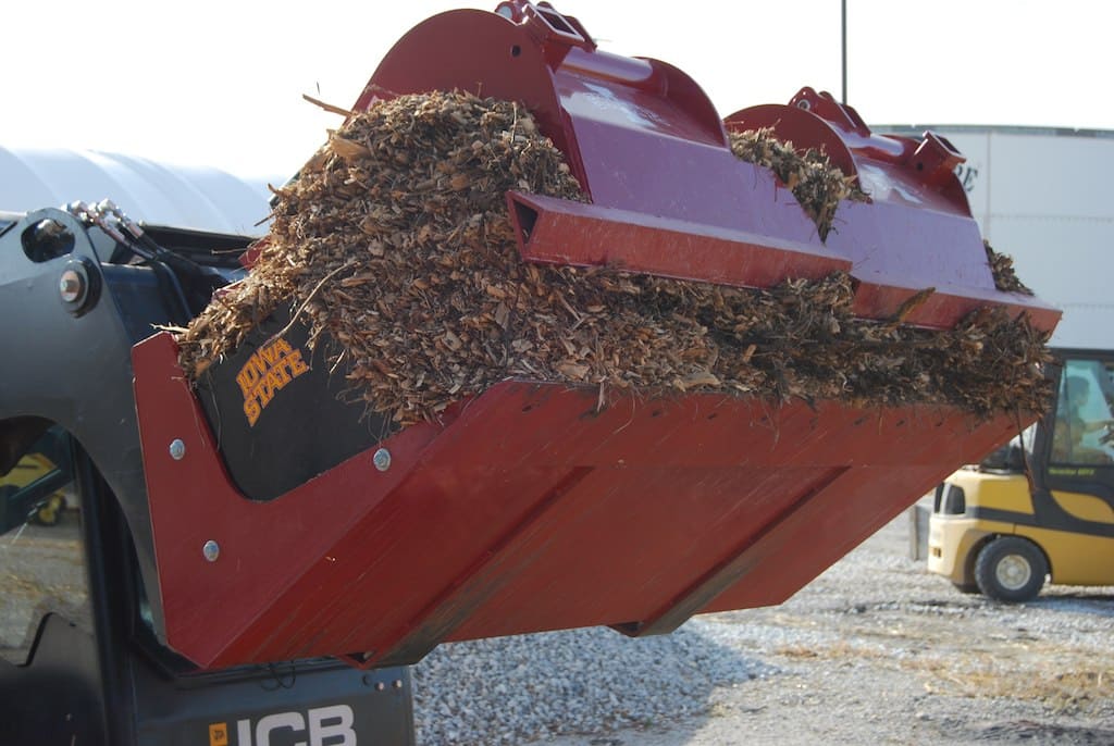 grapple bucket for skid steer with dirt from demo dozer