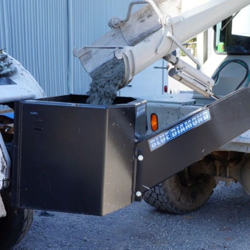 Skid Steer with Blue Diamond Dispensing Bucket attachment.  