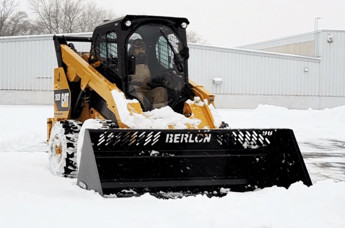 Cat Skid Steer in action with the High Capacity Snow Bucket from Berlon Industries