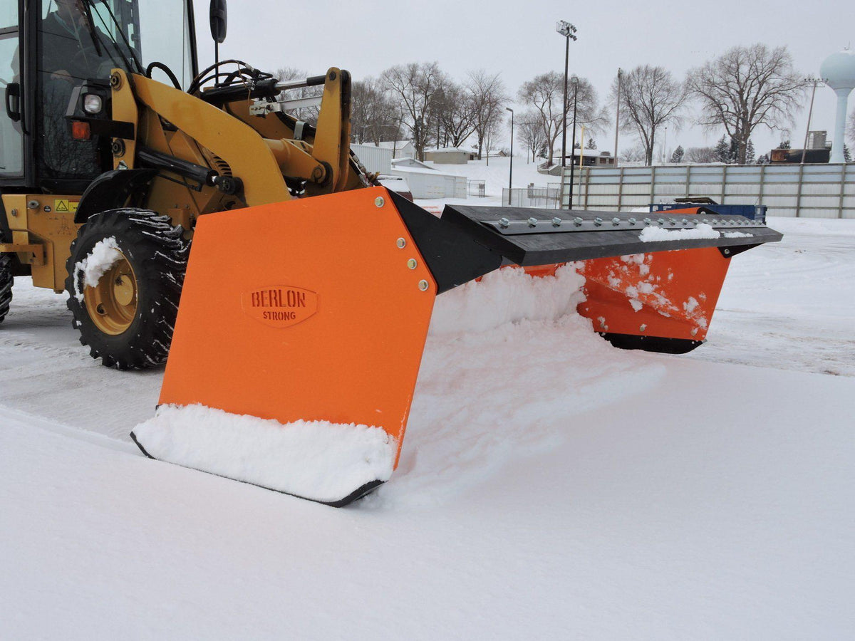 skid steer pushing snow with berlon&#39;s low profile snow pusher attachment