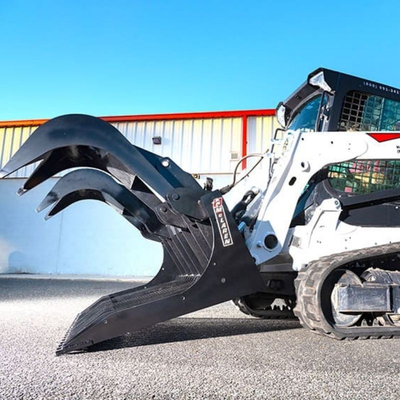 rock rake grapple bucket ready to action on a skid steer from mclaren