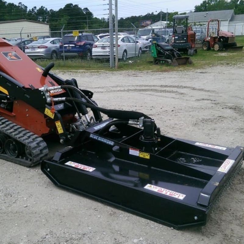 ready to action mini skid steer with the blue diamond brush cutter