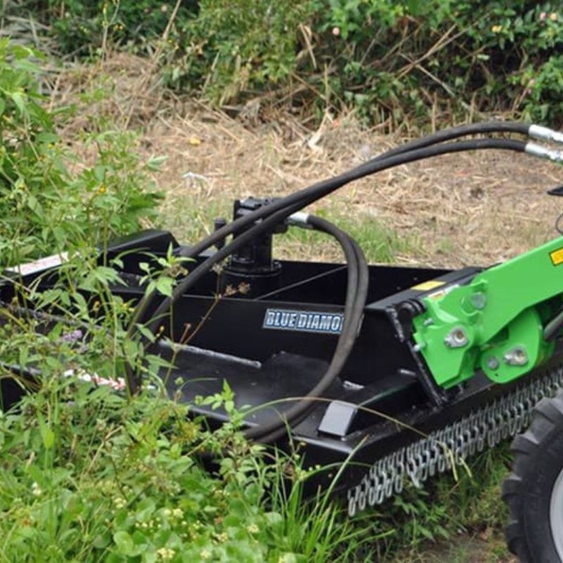 blue diamond mini skid steer closed front brush cutter in action