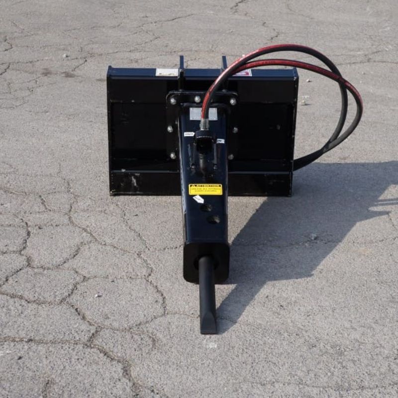 mini skid steer hydraulic breaker attachment on the ground