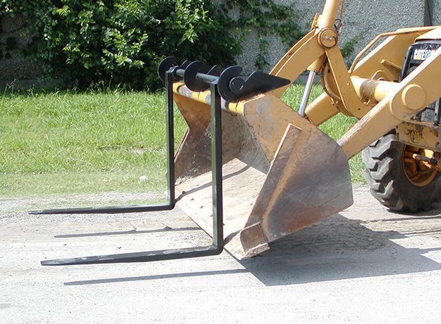 loader with the over-the-bucket forks from star industries in action