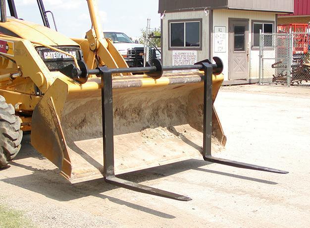 Over-The-Bucket Forks on a Cat Loader ready to action from Star Industries 