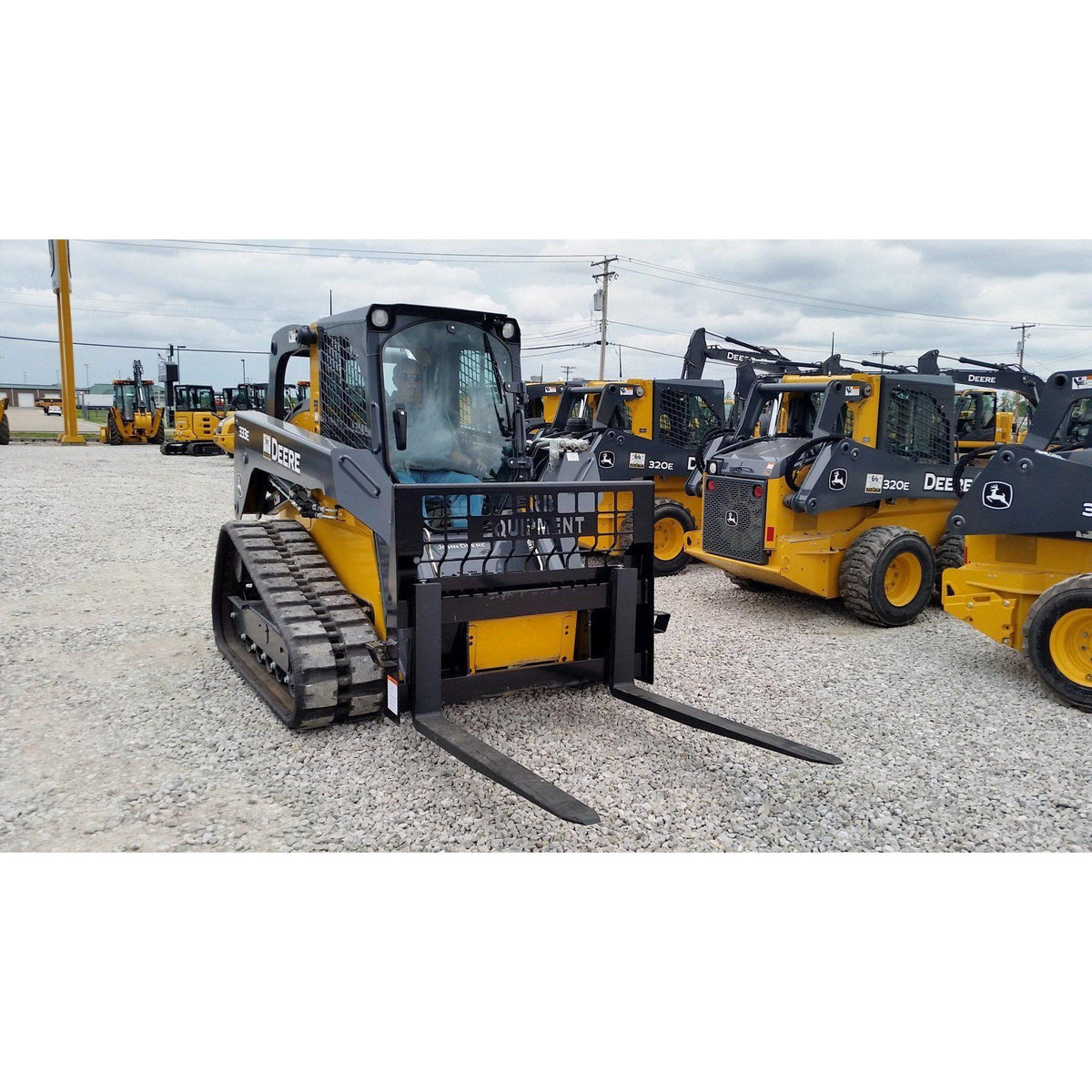 john deere skid steers in the field with pallet forks attachment from berlon