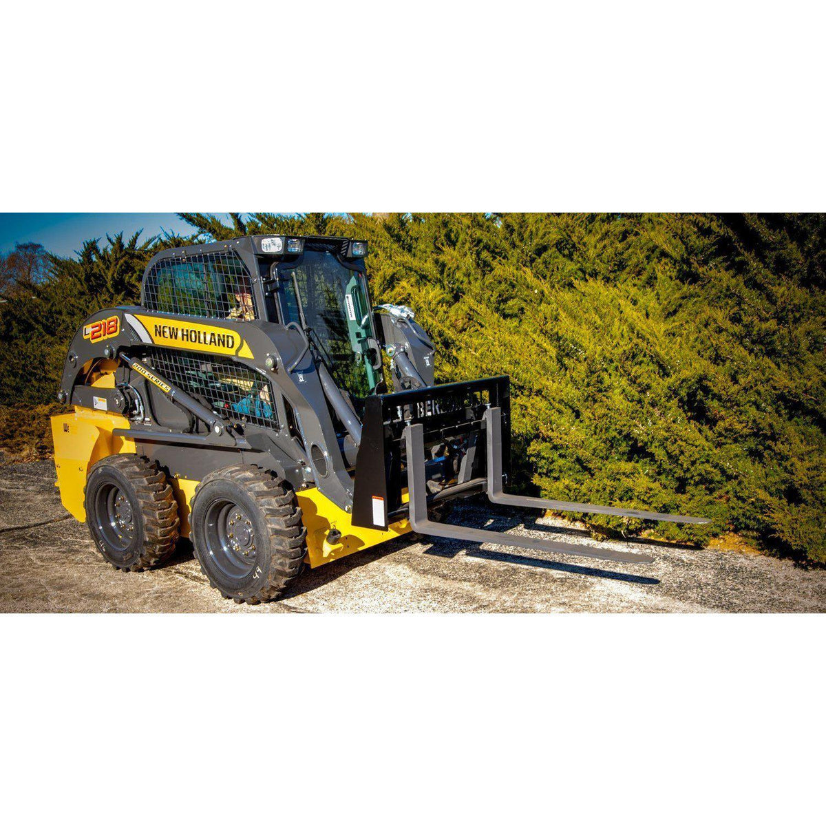 new holland skid steer  with class 3 heavy duty pallet forks attachment from berlon industries