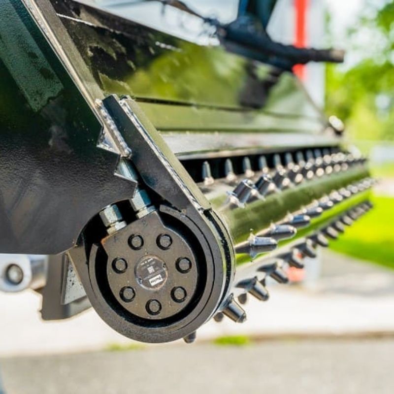 closer look of the power rake bucket attachment for skid steer from mclaren industries
