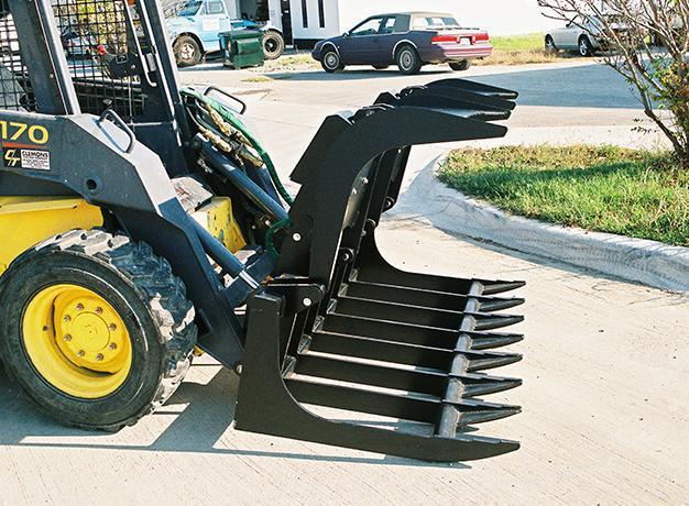 skid steer with the root grapple bucket attachment from star industries
