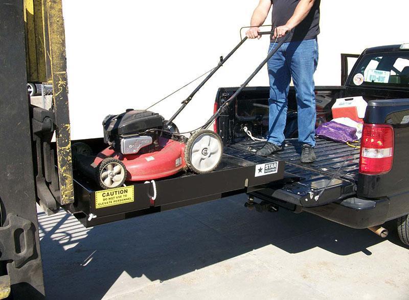 loading a mower on the Safety Loading Platform by Star Industries 