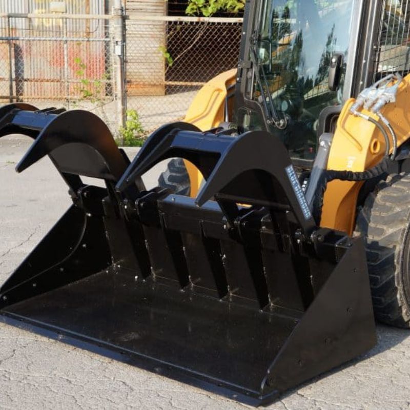 case skid steer with the blue diamond grapple bucket
