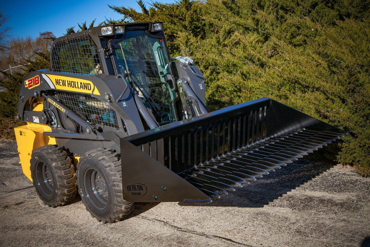 new holland skid steer with the skeleton rock bucket from berlon industries in action