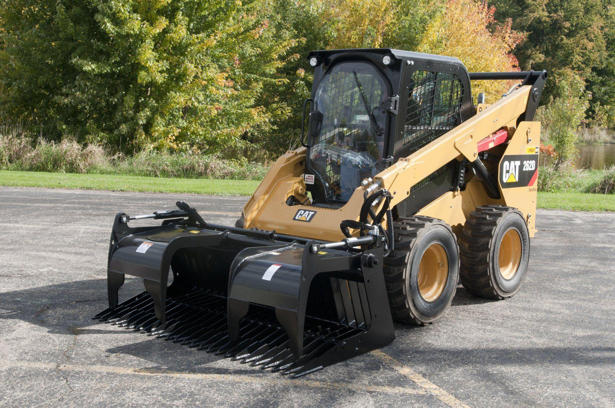 cat skid steer ready to action with the skeleton rock grapple from berlon industries