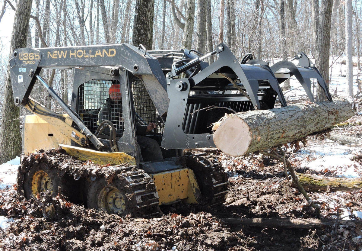 new holland skid steer in action with the skeleton rock grapple attachment from berlon