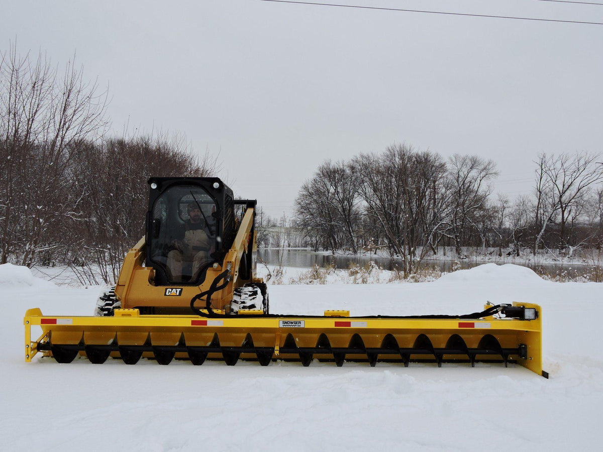 Cat Skid Steer with Snowgrr attachment from Berlon Industries in action on the snow