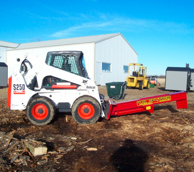 Side profile view of bobcat s250 skid steer with a TM Manufacturing Pro series Skid splitter