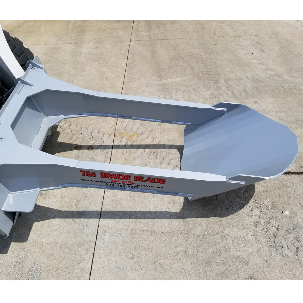 spade blade attachment for skid steer on the ground