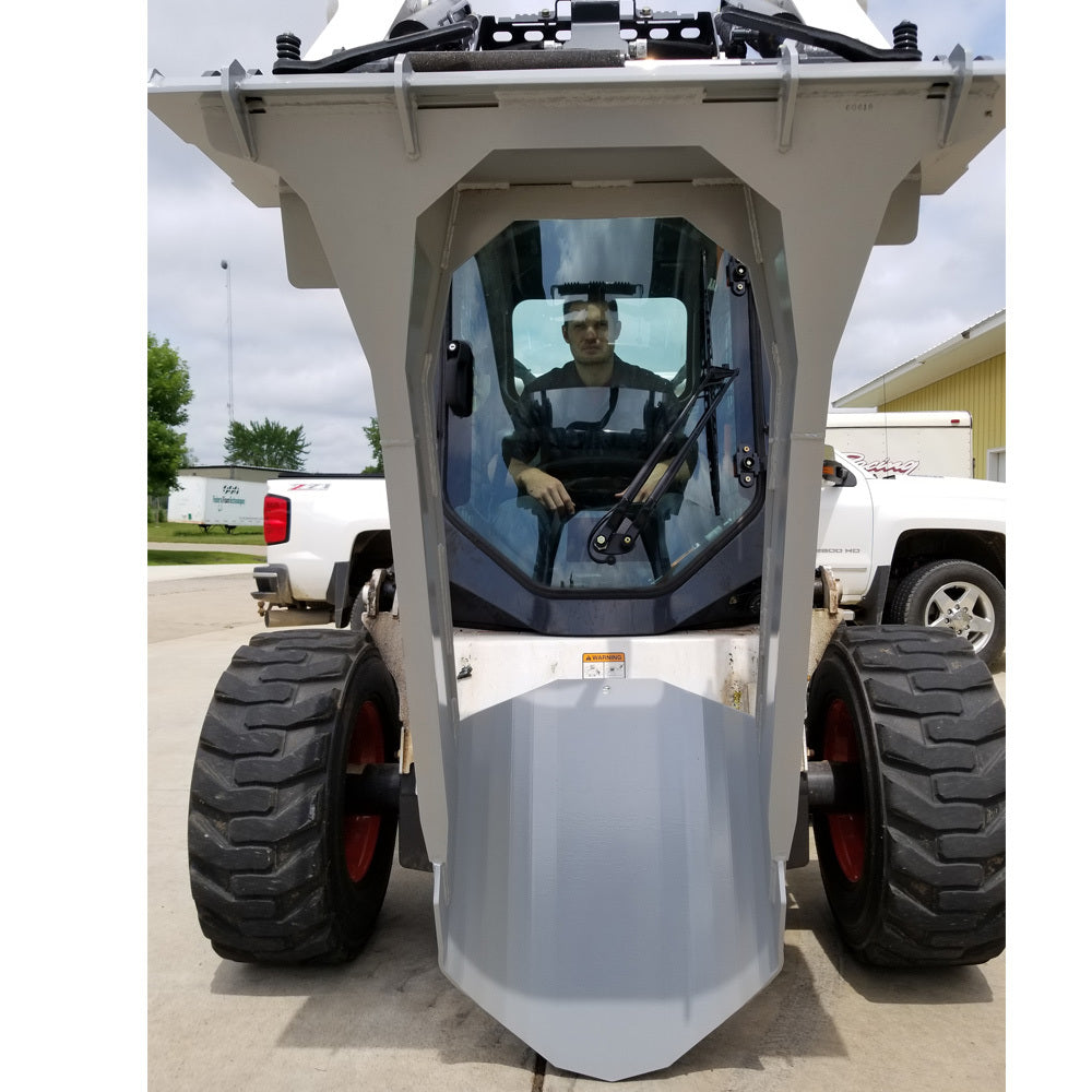 skid steer with the spade blade attachment from tm manufacturing