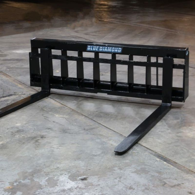 blue diamond 72 wide frame pallet fork attachment on the ground