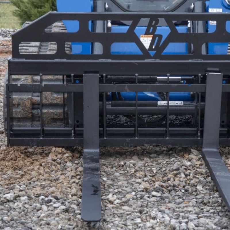 skid steer with the blue diamond heavy duty 72 wide pallet fork attachment