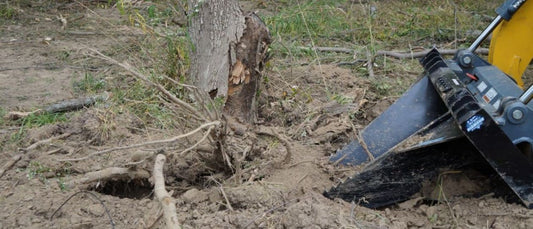 skid stump bucket removing a stump