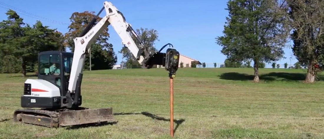 bobcat e55 driving a fence post