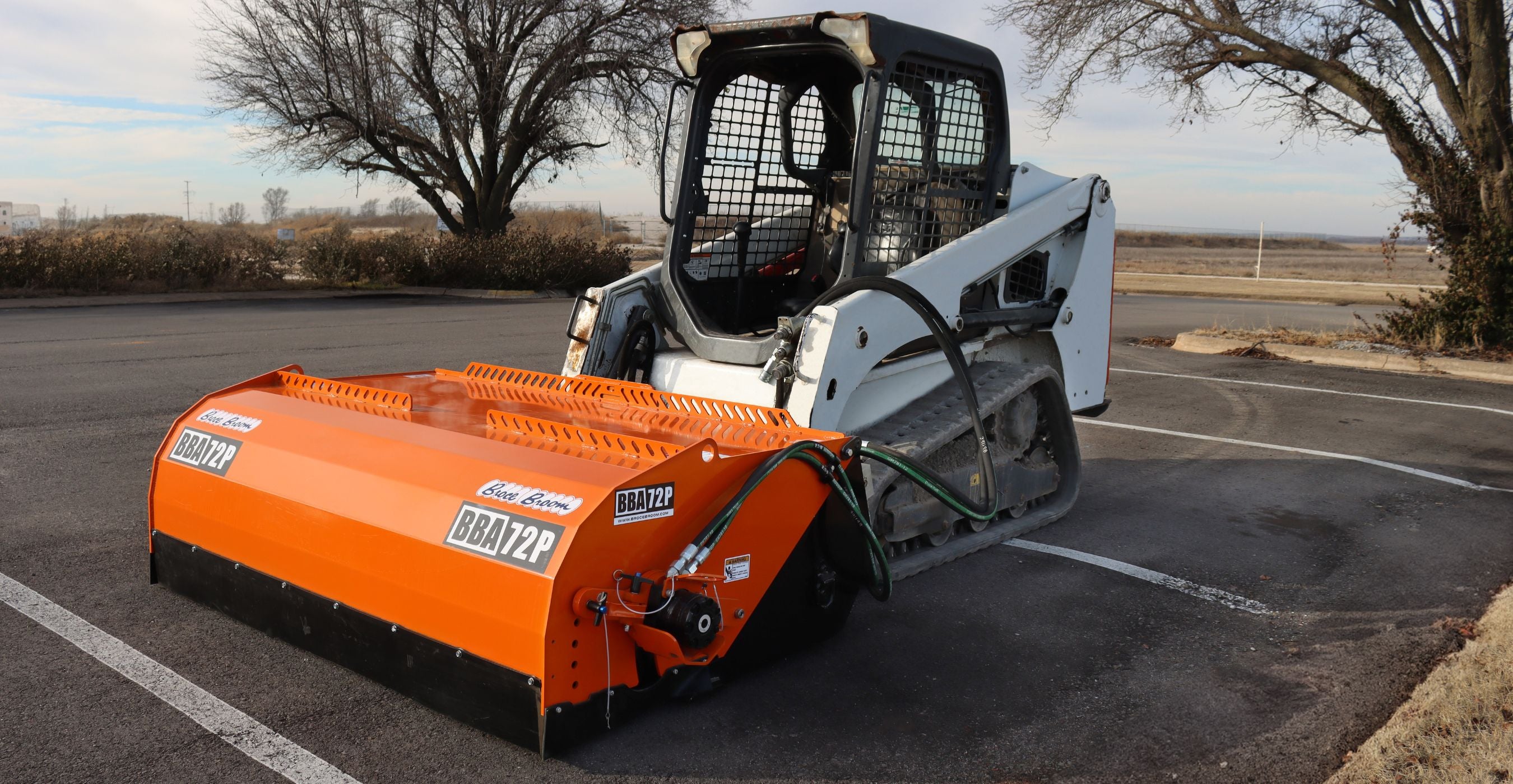 bobcat-skid-steer-with-the-Broce-BBA72P-pick-up-broom-ready-to-action