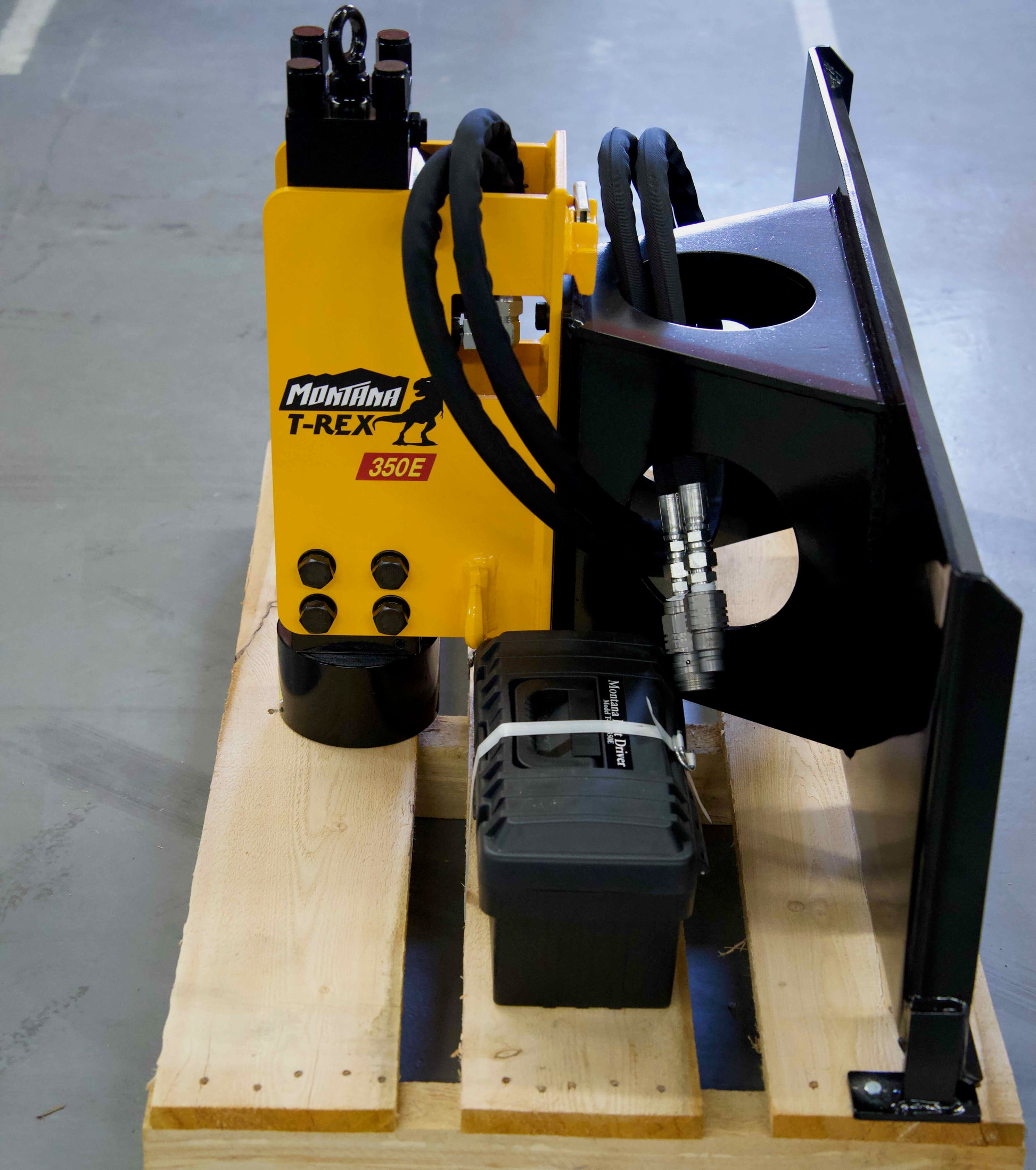 Montana T-Rex 350E fork-mounted breaker attachment with hydraulic hoses and a tool case on a pallet