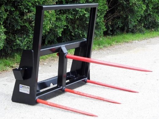 Durable bale spear attachment on the ground for skid steers by Berlon