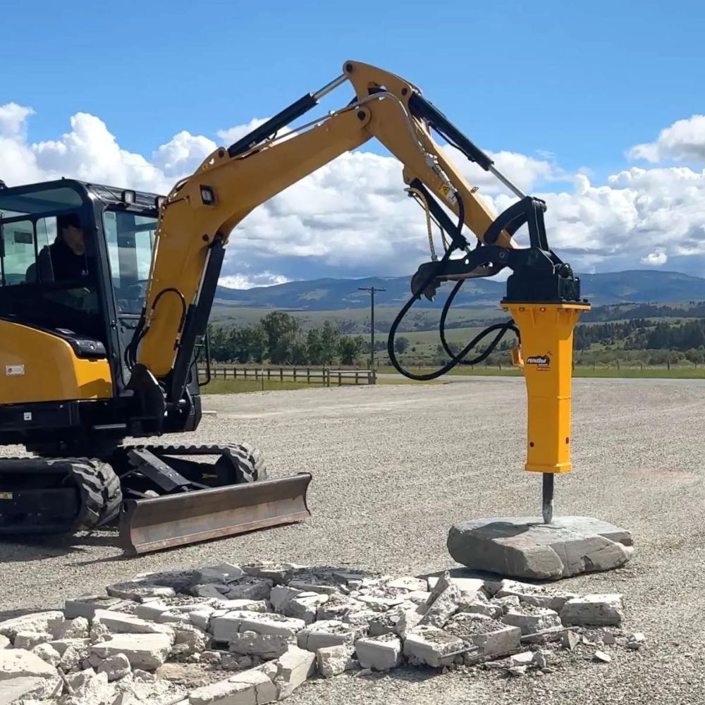 breaking-concrete-with-the-hydraulic-mini-excavator-hammer-from-montana
