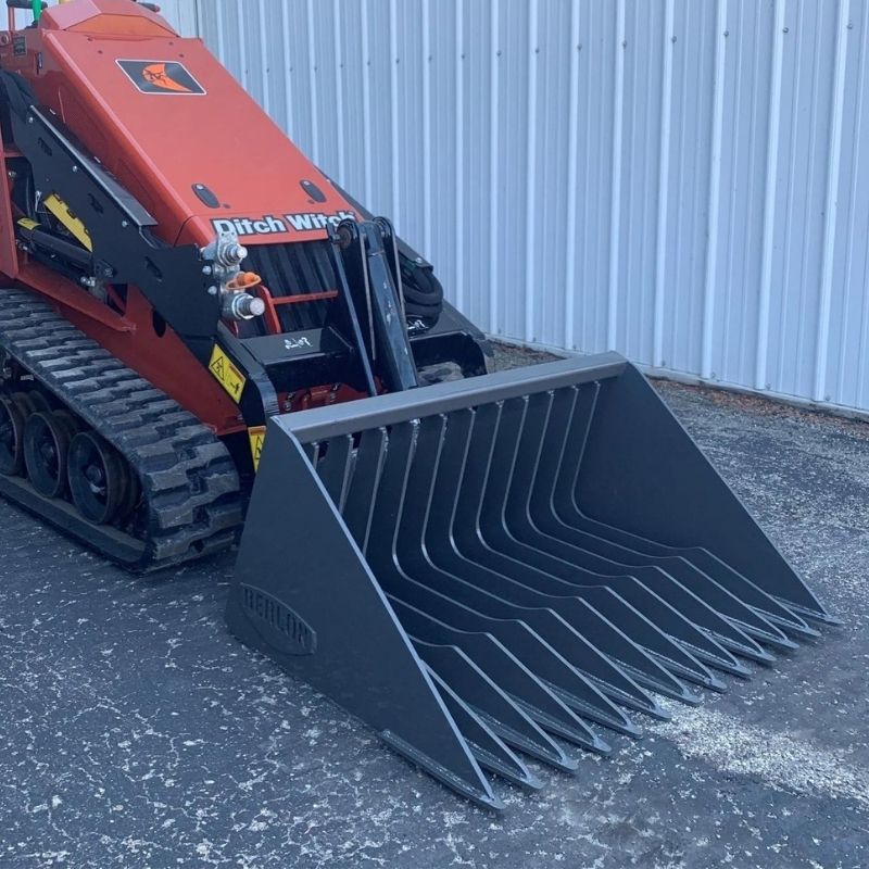 Ditch Witch mini skid steer with the open front brush cutter attachment ready to work 