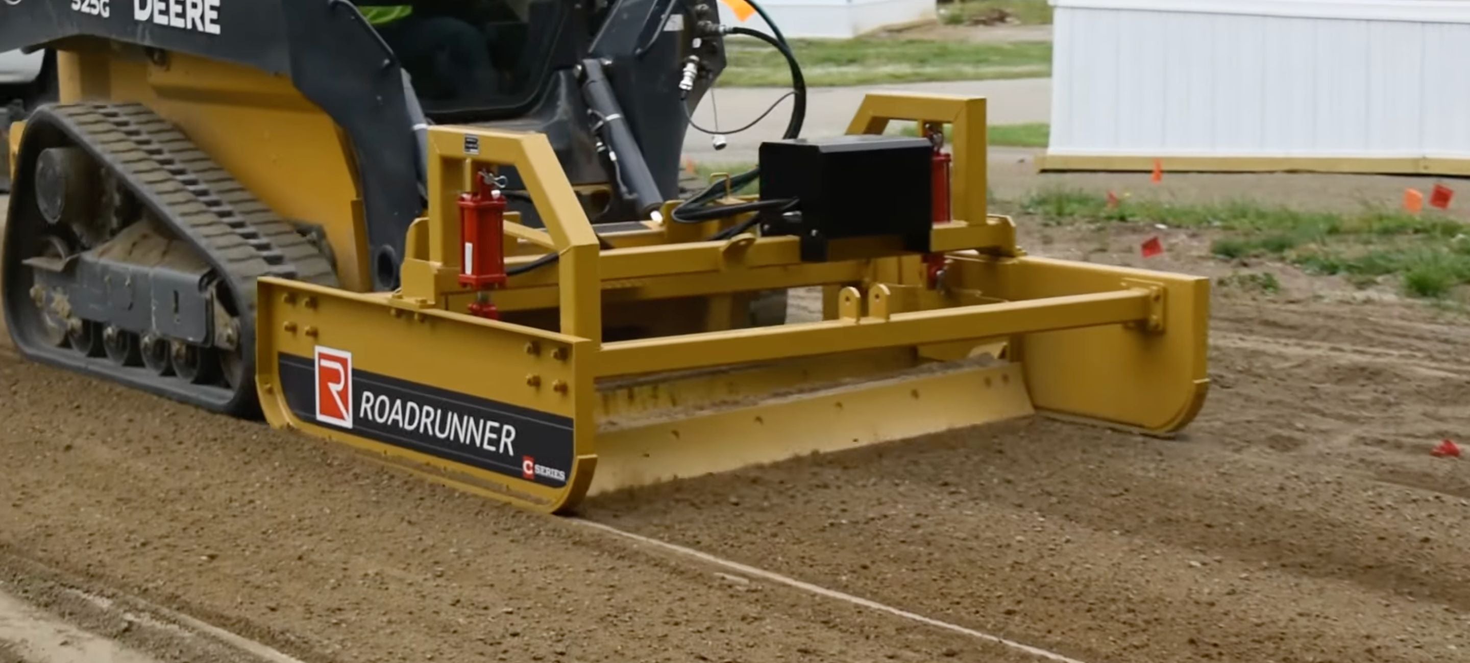 john-deere-with-the-smooth-blade-grader-attachment-from-roadrunner-in-action