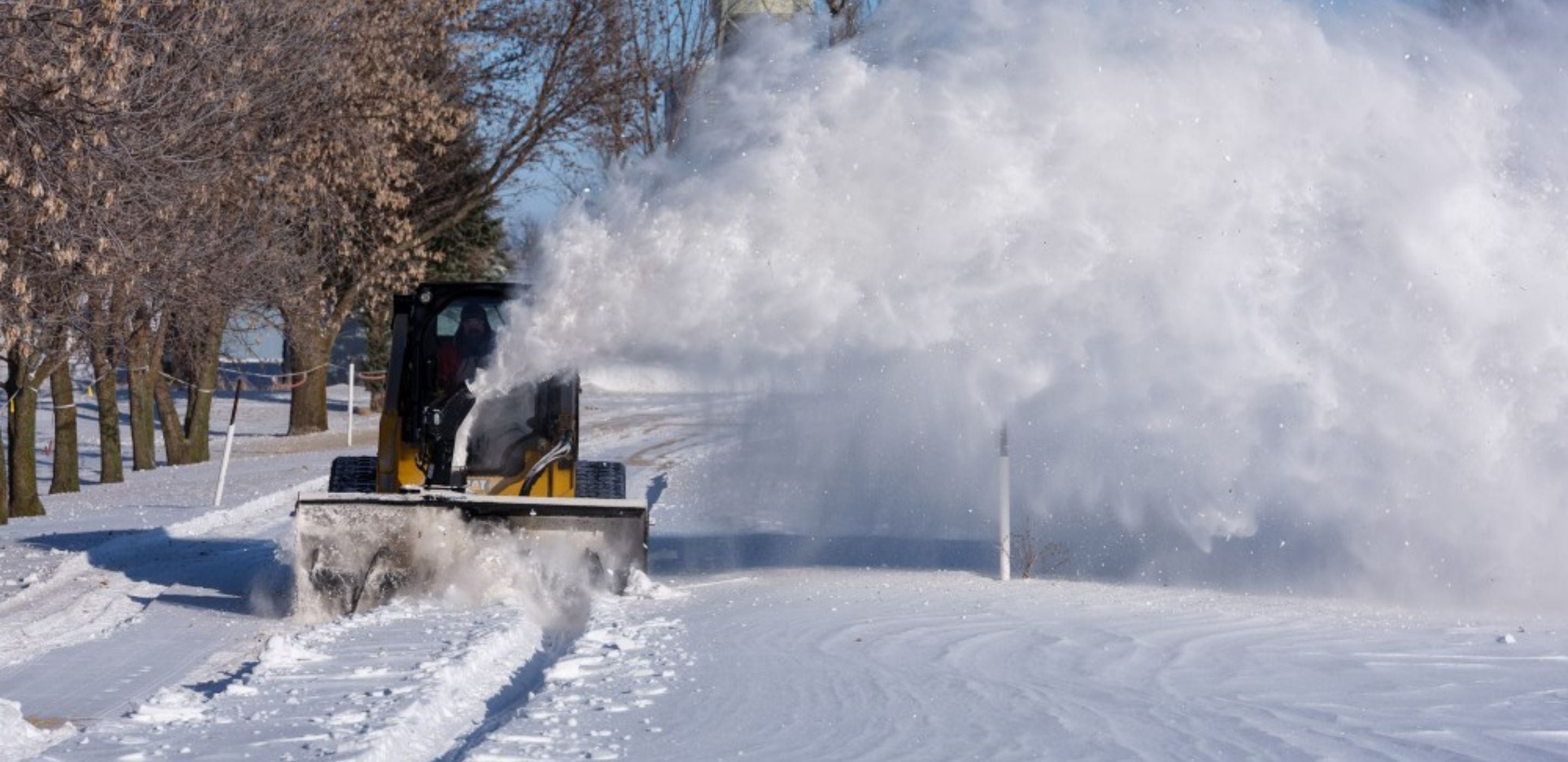 John Deere with a snow blower