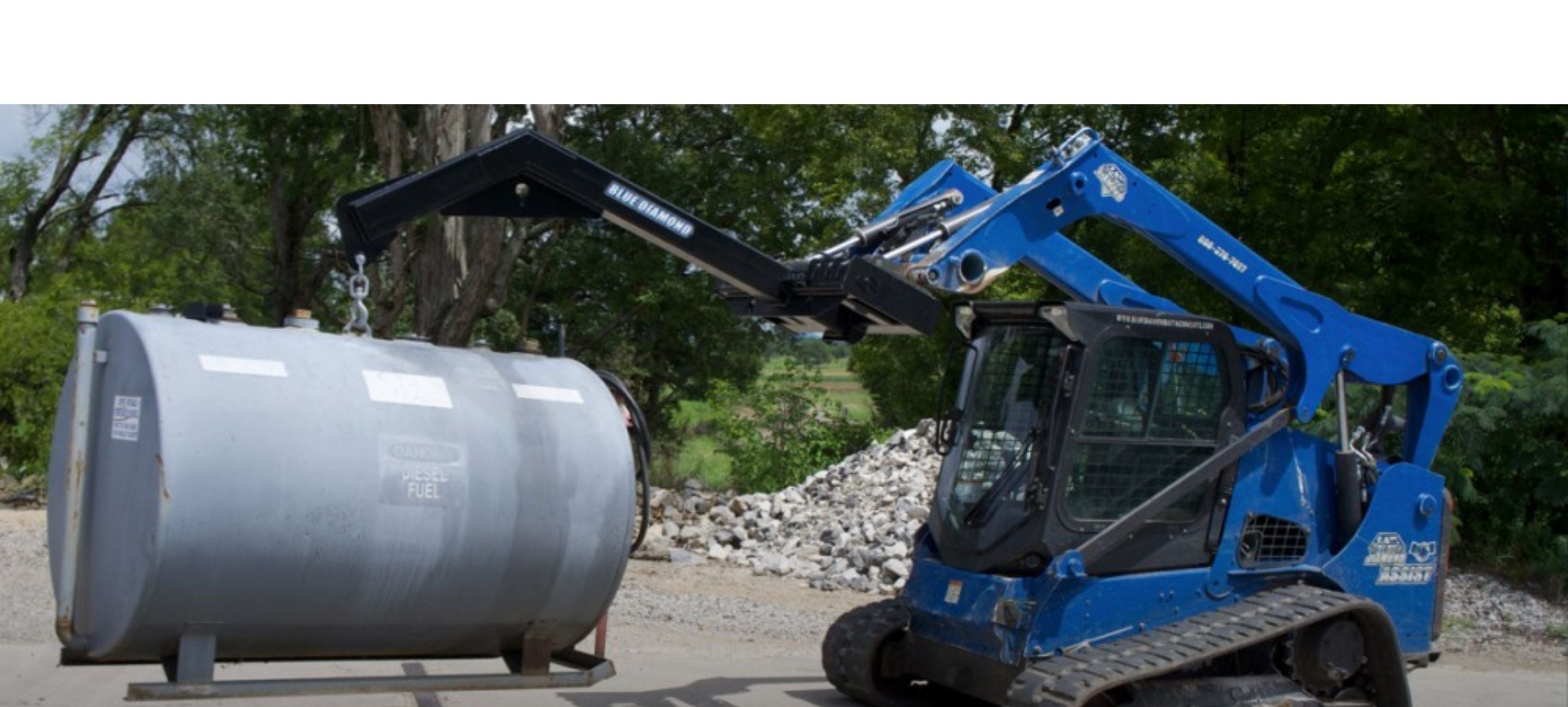 USA made adjustable jib attachment by blue diamond on a skid steer ready to lift heavy stuff