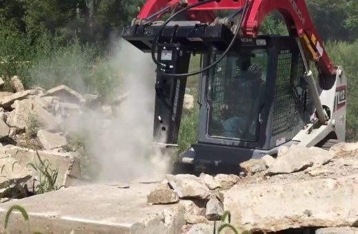 Blue Diamond Hydraulic Breaker attachment for skid steer in action