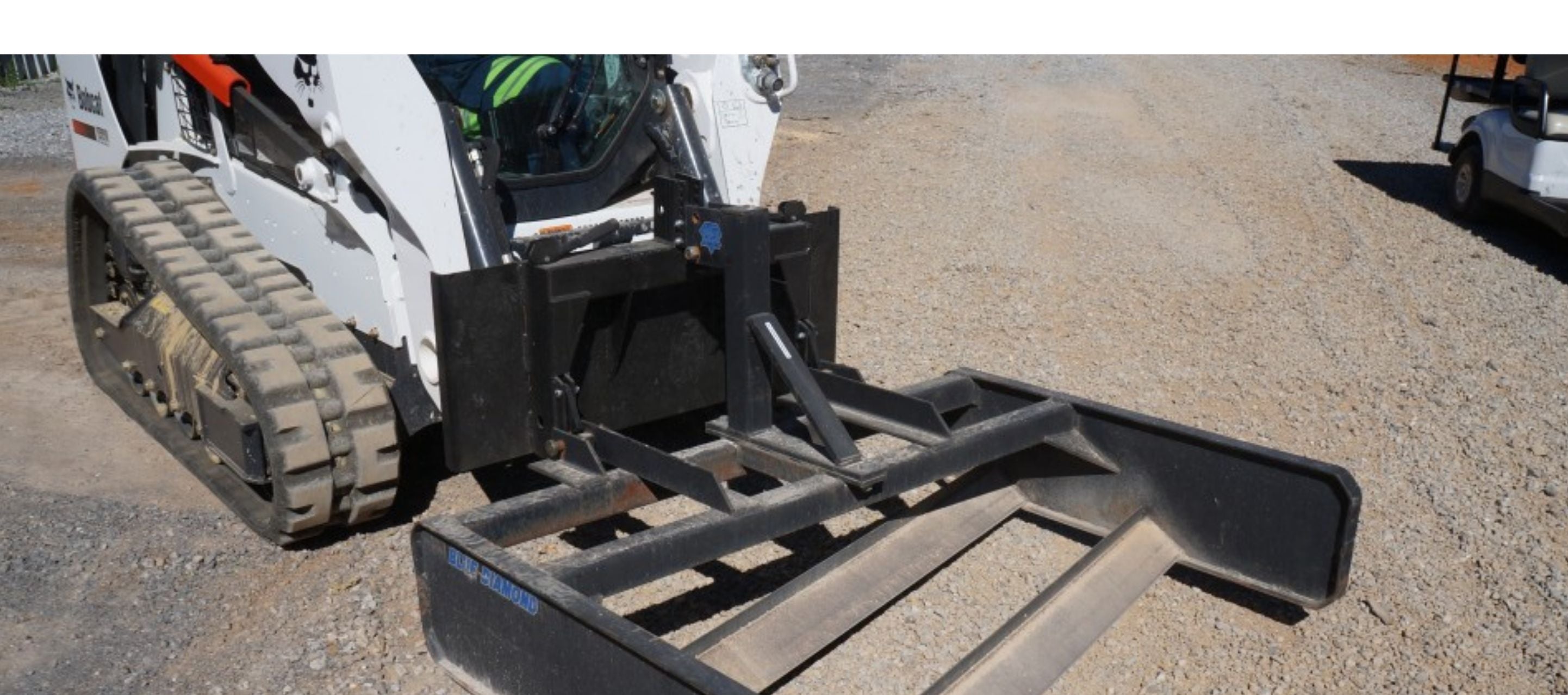 Bobcat skid steer with the Blue Diamond Land Plane attachment