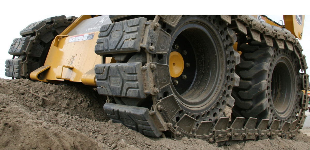 Skid Loader Tracks Over The Tire