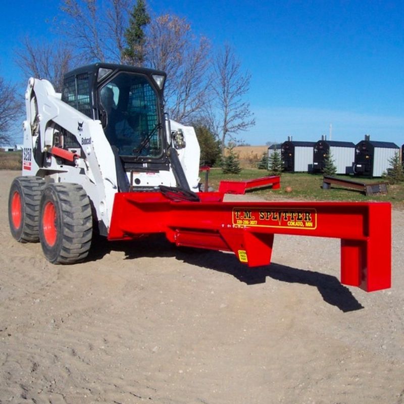 Bobcast skid steer with the log splitter attachment from TM manufacturing