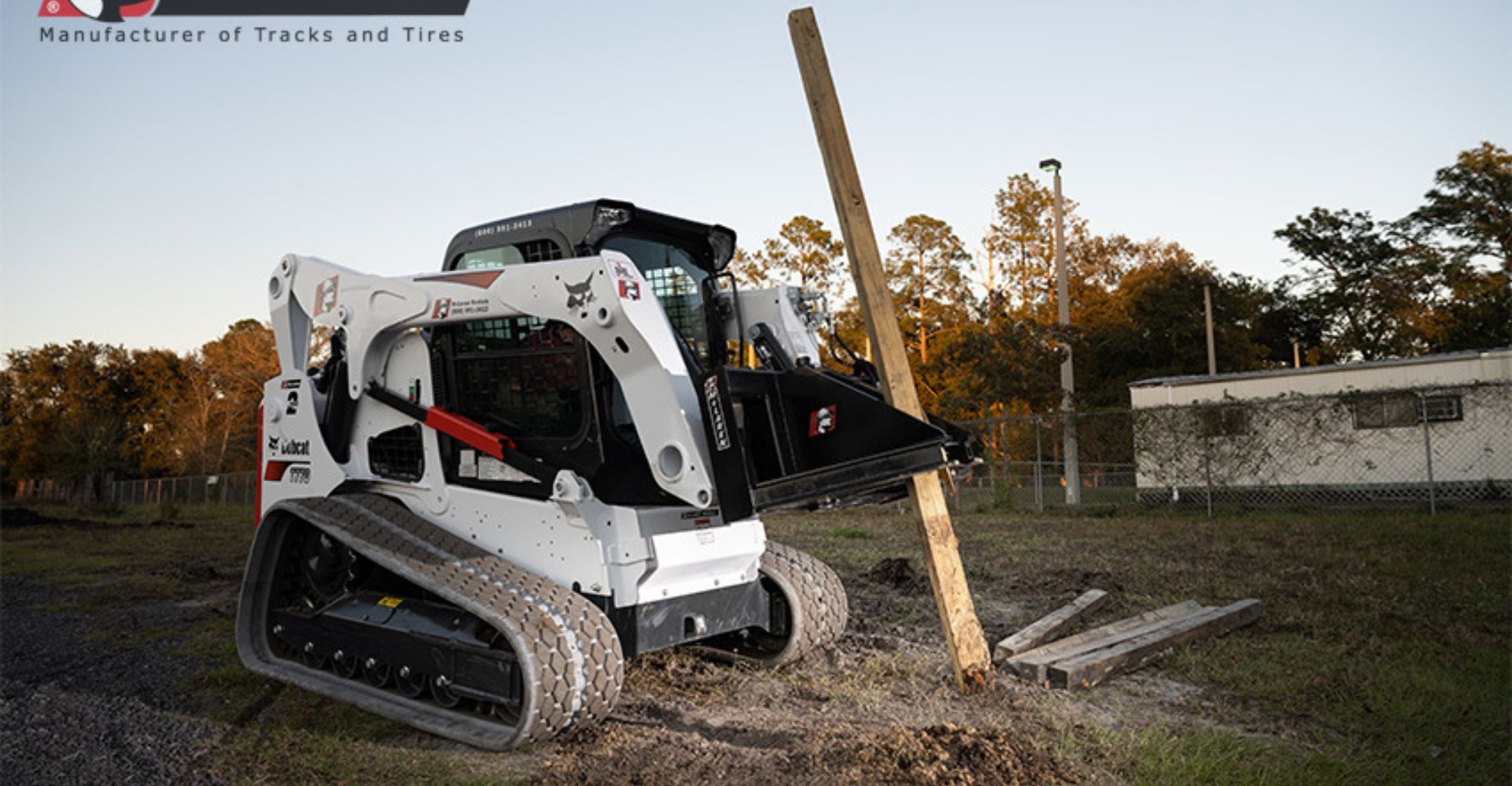 Tree puller attachment on a skid steer pulling out posts from McLaren Industries