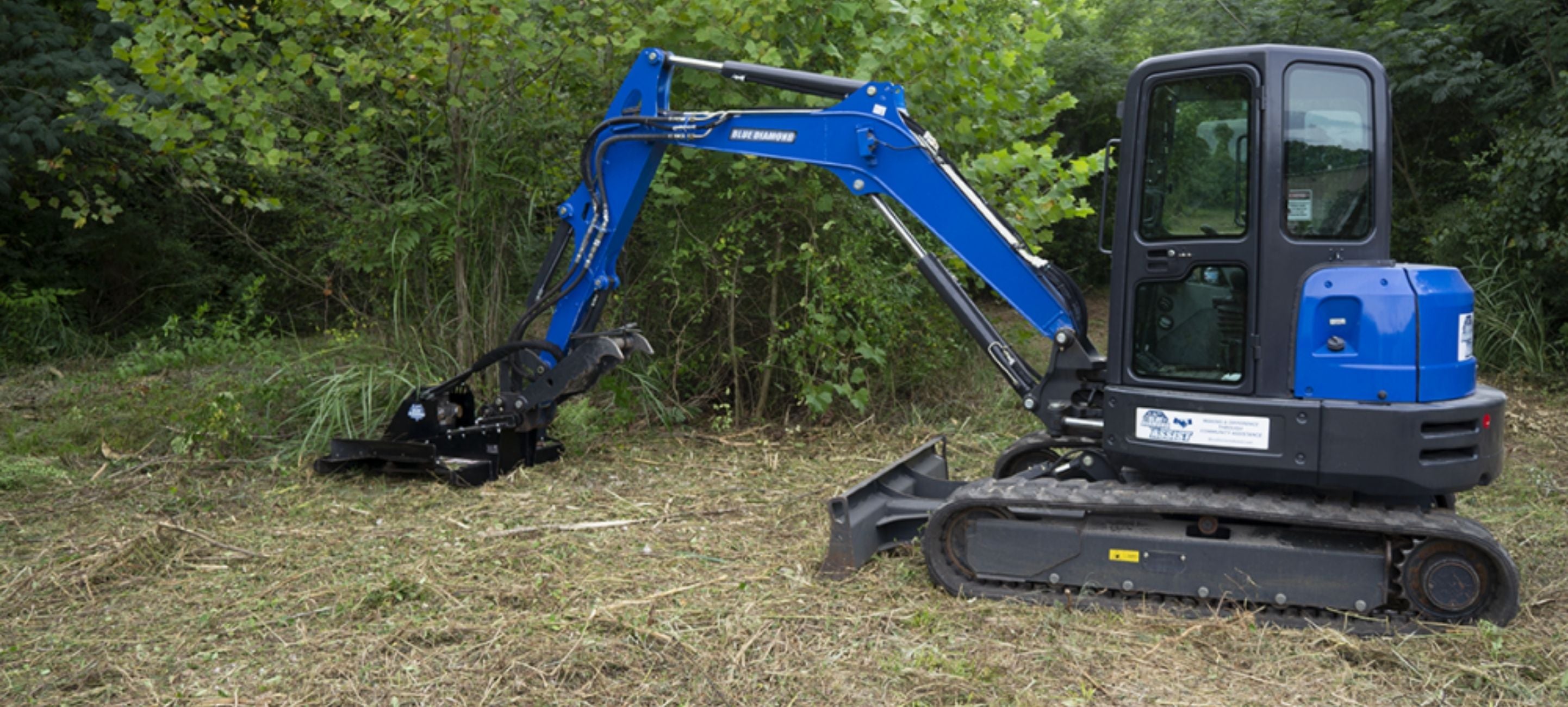 Clearing the bush with the Blue Diamond excavator brush cutter. 