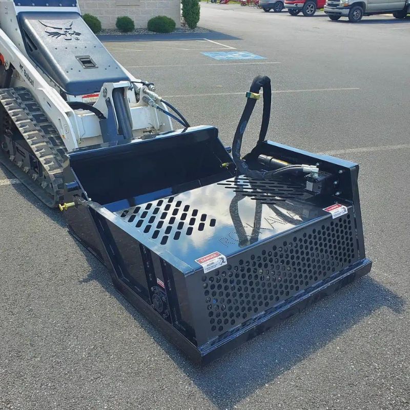 mini-rock-rake-on-a-mini-bobcat-skid-steer