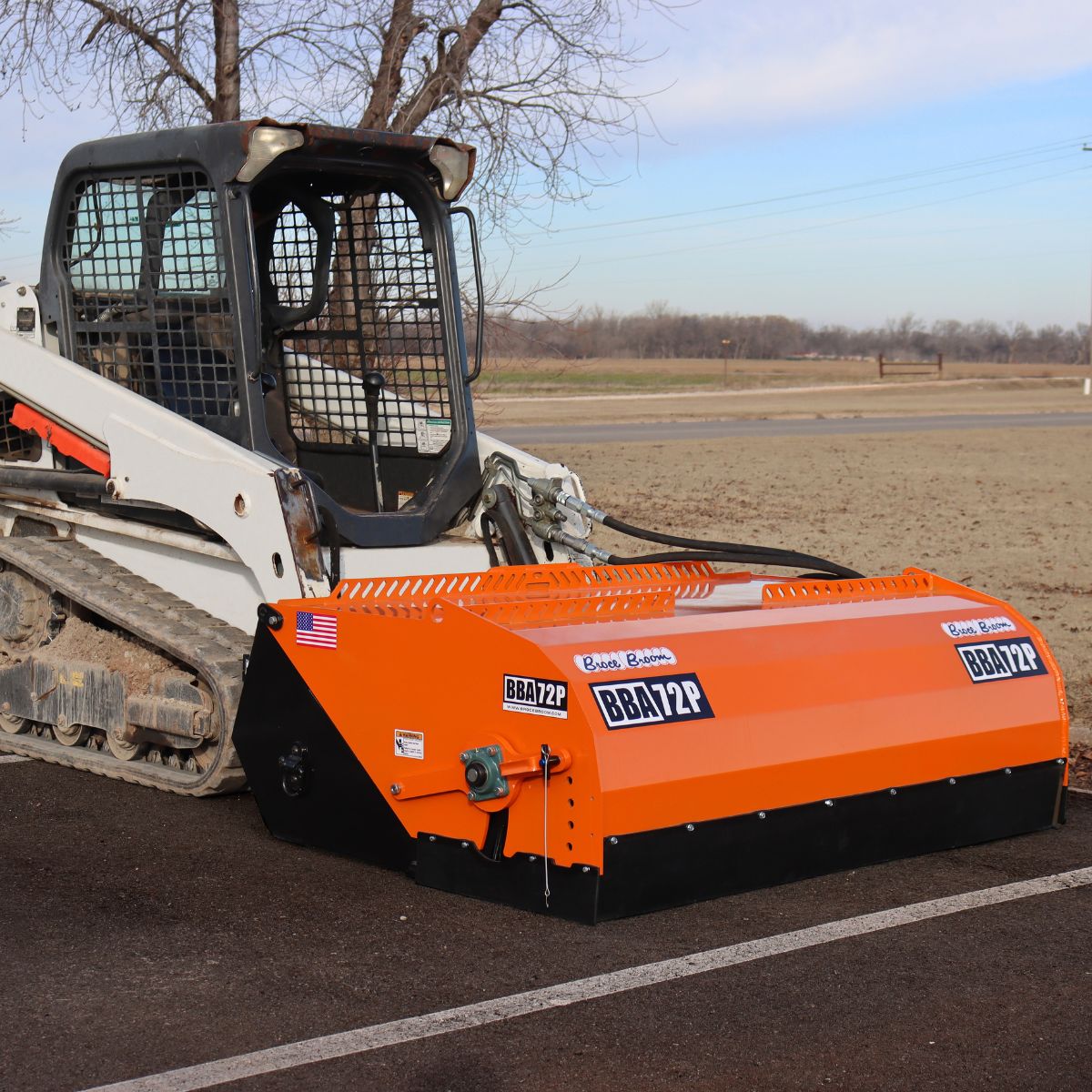 bobcat-skid-steer-with-the-broce-pickup-broom-in-the-field