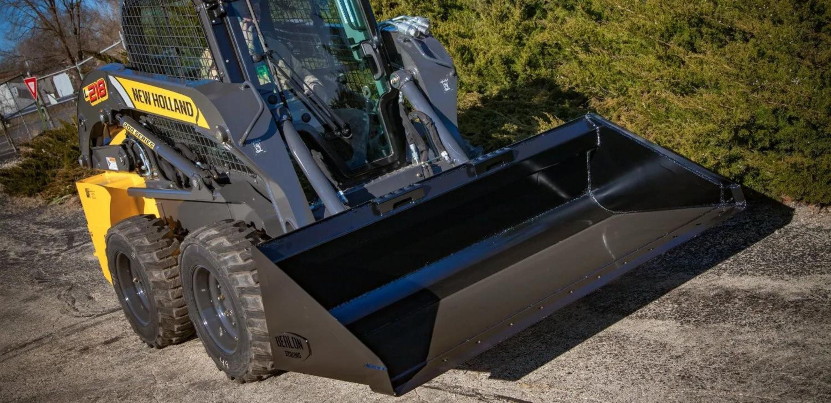 New Holland skid steer with the Berlon bucket attachment for sale